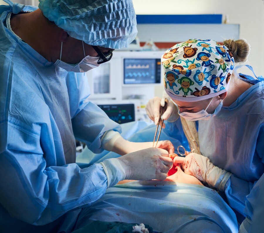 Experienced surgeons performing a minimally invasive urology procedure in a modern operation theatre for ZSR circumcision treatment in Delhi.