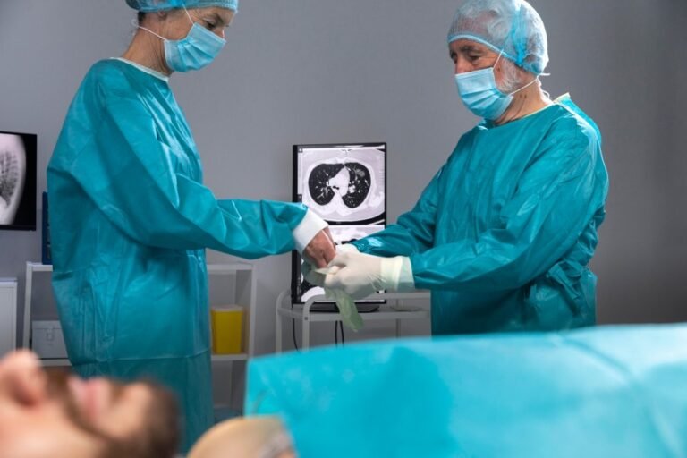 Doctors preparing for a surgical procedure in an operating room